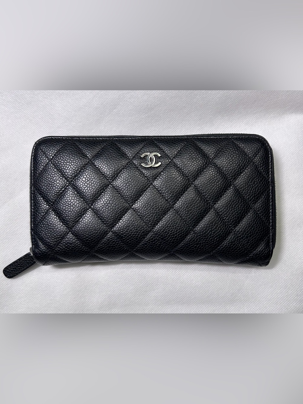 Chanel Long Zipped Wallet in black quilted caviar leather silver-tone hardware